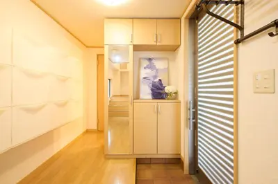 a walk in closet with white cabinets and a door at Near Ueno House 7min Honkomagome 9min Sendagi in Tokyo