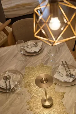 a table with plates and wine glasses on it at Near Ueno House 7min Honkomagome 9min Sendagi in Tokyo