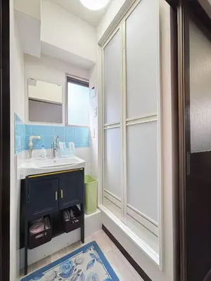 a bathroom with a sink and a mirror at Ueno358 in Tokyo
