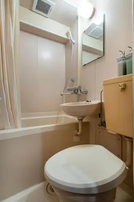 a bathroom with a toilet and a sink at CraftFlat Numabukuro 305, uphill residence in Tokyo