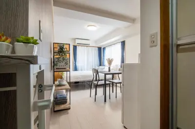 a room with a kitchen and a dining room at CraftFlat Numabukuro 305, uphill residence in Tokyo