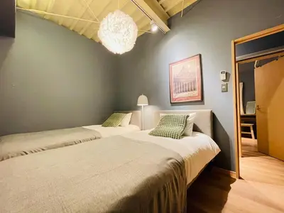 a bedroom with two beds and a chandelier at Taito City, Higashiasakusa-3F-TT0304 in Tokyo