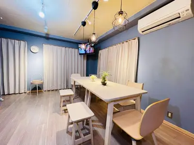 a dining room with a table and chairs and a tv at Taito City, Higashiasakusa-3F-TT0304 in Tokyo
