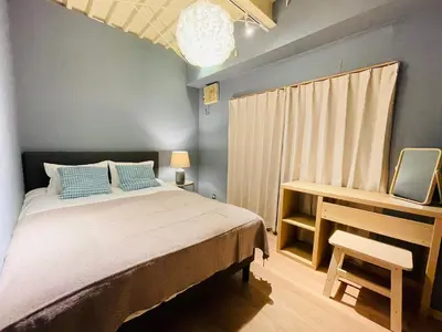 a bedroom with a bed and a desk and a window at Taito City, Higashiasakusa-3F-TT0304 in Tokyo