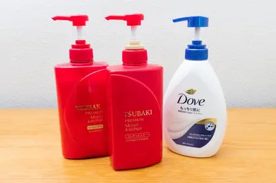 a group of three bottles of detergent sitting on a table at Hanna Inn SHIBUYA 501 in Tokyo