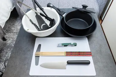 a table with a knife and some utensils on it at Hanna Inn SHIBUYA 102 in Tokyo