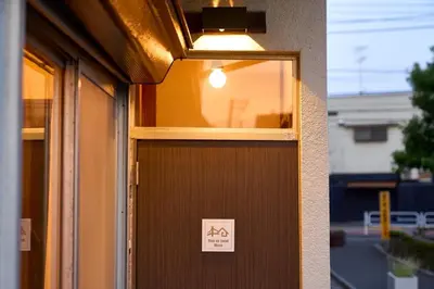a door with a sign on it with a light on it at Stay as Local mizue in Tokyo