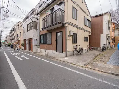 an empty street with buildings on the side of the road at Mori Hotel \u897f\u6c60\u888b in Tokyo