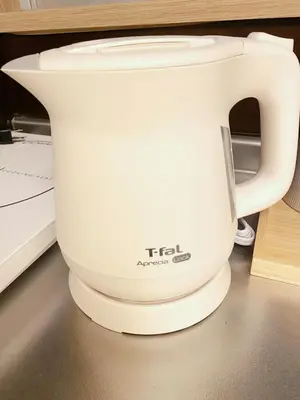 a white tea kettle sitting on top of a counter at Mori Hotel \u897f\u6c60\u888b in Tokyo