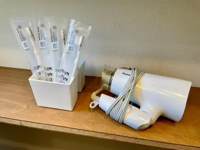 a white appliance sitting on a table with some plasticaments at \u30a8\u30fc\u30c7\u30eb\u30ef\u30a4\u30b9 Edelweiss in Tokyo