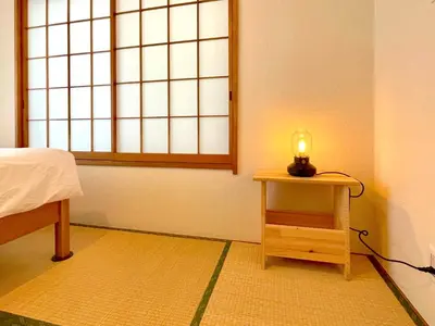 a room with a small table with a candle on it at \u30a8\u30fc\u30c7\u30eb\u30ef\u30a4\u30b9 Edelweiss in Tokyo