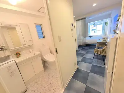 a bathroom with a toilet and a sink at Louis House\u5927\u585a\u897f \u6c60\u888b2\u5206 in Tokyo