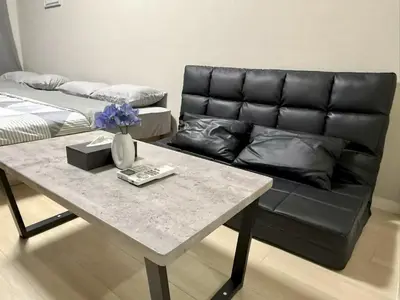 a living room with a couch and a table at \u6c60\u888b Energy CA0 a9 in Tokyo