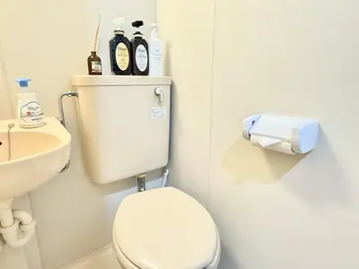 a bathroom with a white toilet and a sink at \u6c60\u888b Energy CA0 a9 in Tokyo