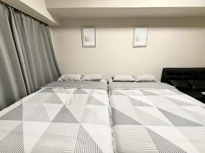 two beds sitting in a room with at \u6c60\u888b Energy CA0 a9 in Tokyo