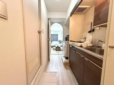a kitchen with a sink and a counter top at Ikebukuro IVY House Ao6 in Tokyo