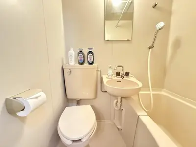 a small bathroom with a toilet and a sink at Ikebukuro IVY House Ao6 in Tokyo
