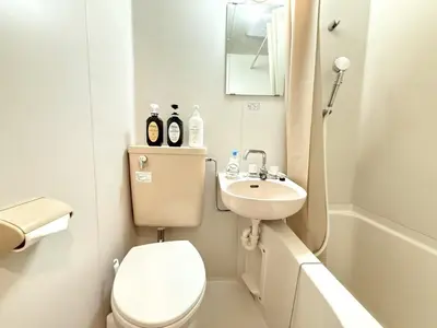 a small bathroom with a toilet and a sink at Ikebukuro Warm\u30cf\u30a6\u30b9306 in Tokyo
