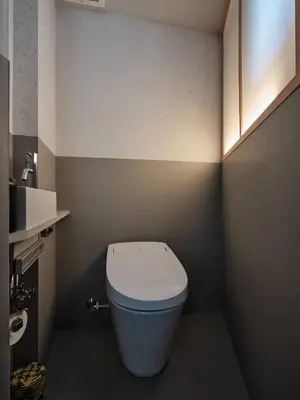 a small bathroom with a white toilet in it at New Open 