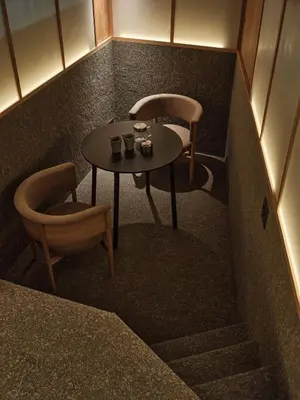 a small table and two chairs in a room at New Open 
