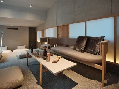 a living room with a couch and a table at New Open 