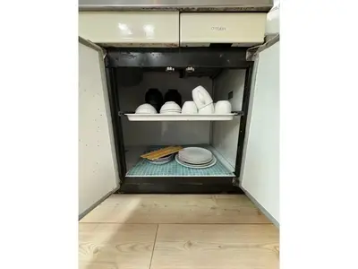 a small refrigerator with plates and dishes in it at Flower House - Vacation STAY 19340 in Tokyo
