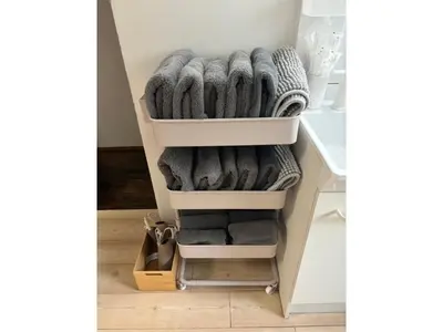 a shelf filled with towels in a room at Flower House - Vacation STAY 19340 in Tokyo
