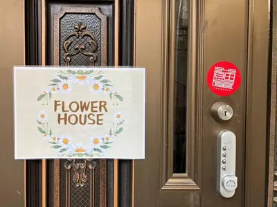 a door with a flower house sign on it at Flower House - Vacation STAY 19340 in Tokyo