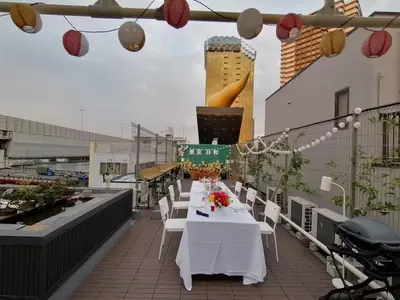 a table with white tables and chairs on a roof at Tokyo Biyori Hotel - Vacation STAY 07393v in Tokyo