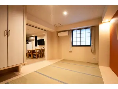 an empty living room with a window and a table at Tokyo Biyori Hotel - Vacation STAY 07403v in Tokyo