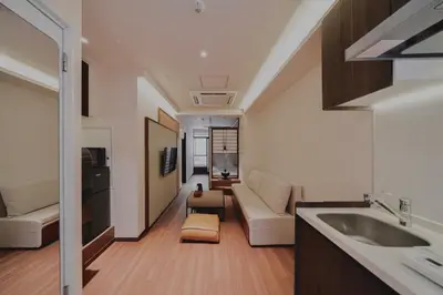 a living room with a couch and a sink in a room at 215 Building - Vacation STAY 19955 in Tokyo