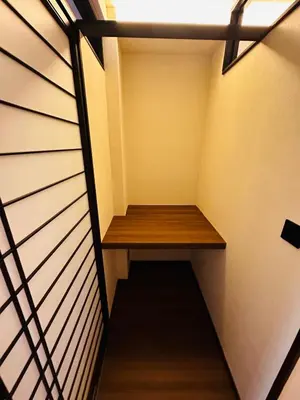 a stairway with a wooden bench in a room at 215 Building - Vacation STAY 19955 in Tokyo