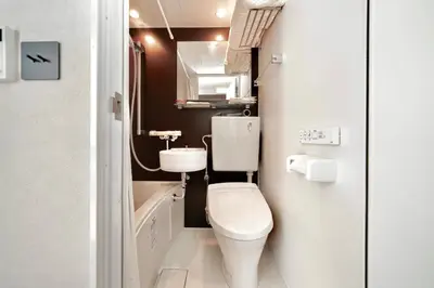 a small bathroom with a toilet and a sink at 215 Building - Vacation STAY 19955 in Tokyo