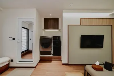 a living room with a couch and a television at 215 Building - Vacation STAY 19955 in Tokyo