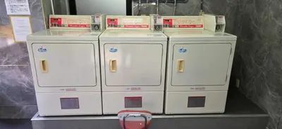a group of four machines sitting on a shelf at HouseHotel\u897f\u6c60\u888b in Tokyo