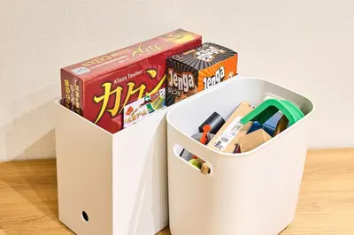 a white container filled with toys and books at HouseHotel\u897f\u6c60\u888b in Tokyo