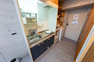 a small kitchen with a sink and a refrigerator at Stayloop\u30b9\u30ab\u30a4\u30c4\u30ea\u30fc in Tokyo