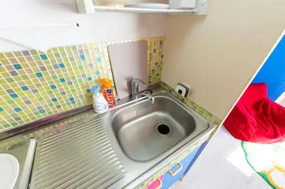 a small bathroom with a sink and a mirror at Stayloop\u30b9\u30ab\u30a4\u30c4\u30ea\u30fc in Tokyo