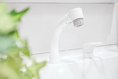 a bathroom sink with a white faucet at Unite Stay Gyotoku in Tokyo