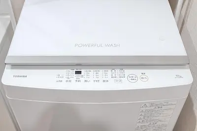 a white dishwasher with a white box on top of it at Unite Stay Gyotoku in Tokyo