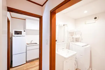 a bathroom with a sink and a mirror at Unite Stay Gyotoku in Tokyo