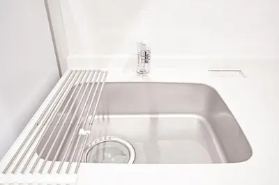 a silver sink with a faucet in a room at Unite Stay Gyotoku in Tokyo