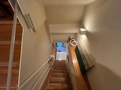 a staircase in a house with wooden floors at Asakusa Loft in Tokyo