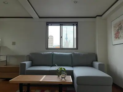 a living room with a couch and a table at Asakusa Loft in Tokyo