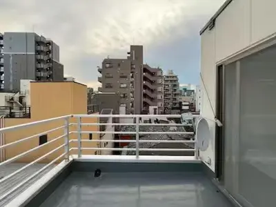 a balcony of a building with a view of a city at Asakusa Loft in Tokyo