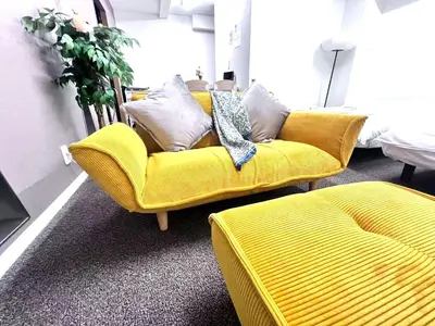 a yellow couch in a room with a bed at \u6751\u4e0a\u7fa9\u7537\u30c7\u30b6\u30a4\u30f3 \u6771\u4eac\u90fd\u5fc3 \u5b8c\u5168\u8cb8\u5207 \u6620\u753b\u5ba4 \u6c60\u888b\u96fb\u8eca6\u5206 \u65b0\u5bbf\u6e0b\u8c37\u76f4\u901a \u30b7\u30e7\u30c3\u30d4\u30f3\u30b0\u306b\u4fbf\u5229 WiFi \u9577\u671fOK WAGAMAMA\u5c0f\u7af9\u5411\u539fTAKA 102\u5ba4 in Tokyo