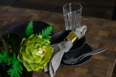 a table with a plate with a bottle of champagne and a fork at \u4e94\u53cd\u91ce in Tokyo