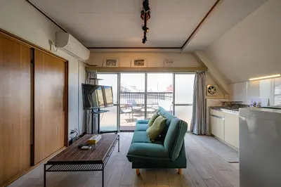 a living room with a couch and a table at \u4e94\u53cd\u91ce in Tokyo