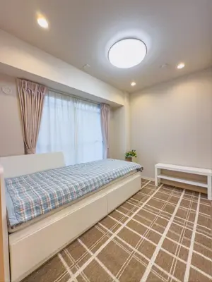 a bedroom with a bed and a window at \u7530\u753a6Floor-MT0393 in Tokyo