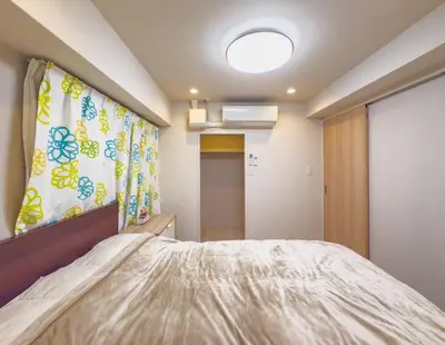 a small bedroom with a bed and a window at \u7530\u753a6Floor-MT0393 in Tokyo